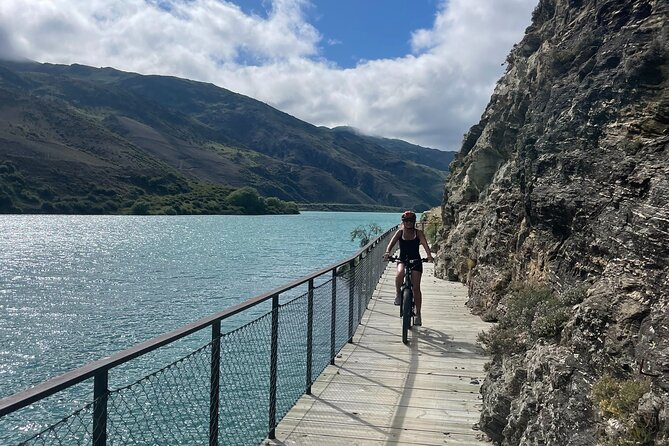 Lake Dunstan Cycleway Bike Rental And Return Shuttle - Rockface clips, water views, and the Hugo Suspension Bridge