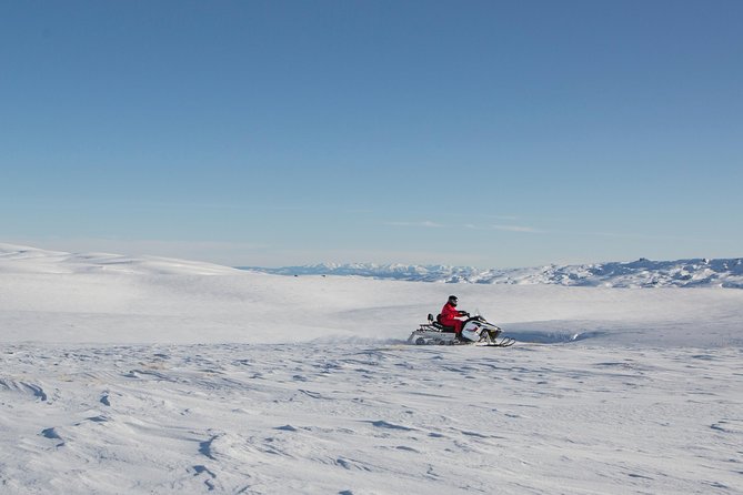 Queenstown Heli-Snowmobiling Adventure - Riding your own snowmobile in a small group