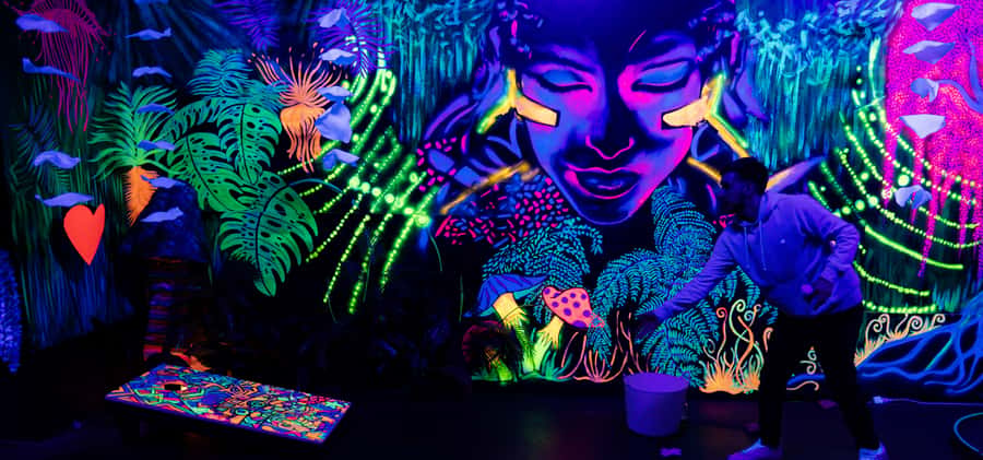 Queenstown: Indoor Putt 'n' Glow Mini Golf - Local art under UV light