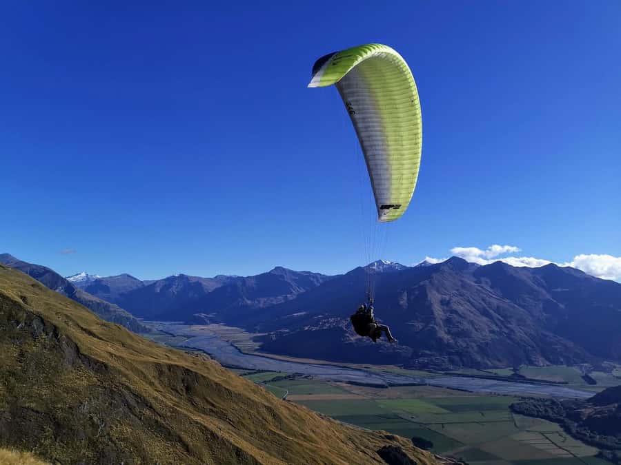 Wanaka: Tandem Paragliding Experience - Taking off above the Matukituki Valley
